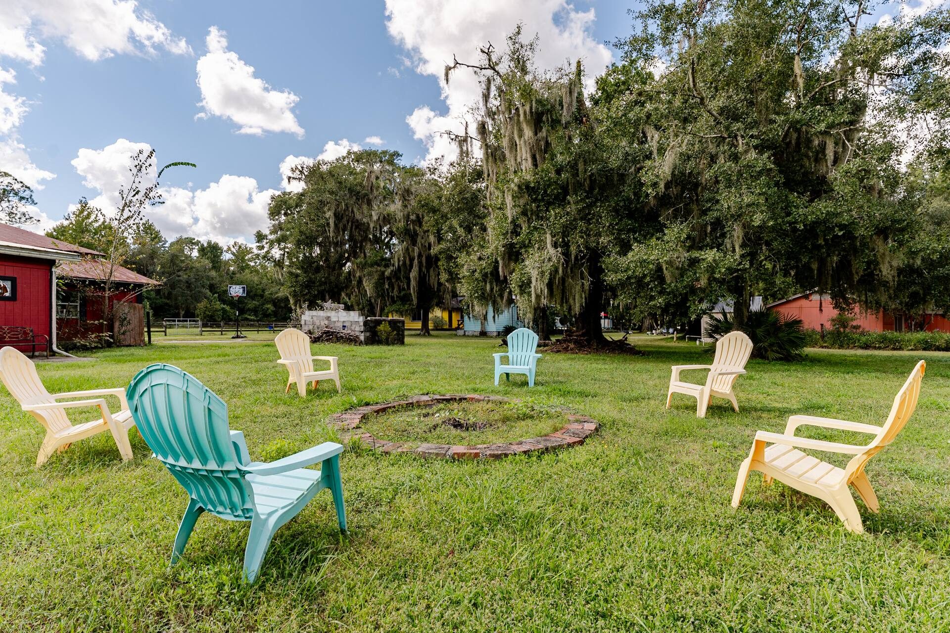 Adirondack chairs around the fire ring